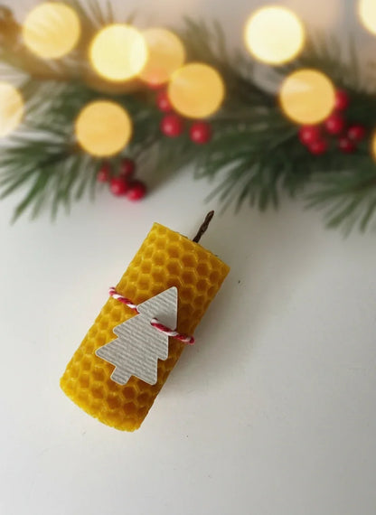 Natural colored candle with Christmas decoration